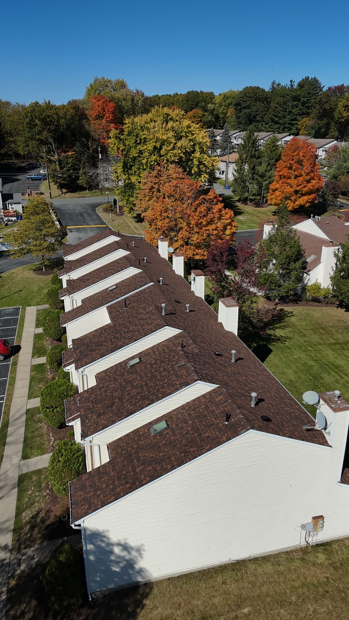 Aerial view along a row of townhome roofs in Middletown, NY
