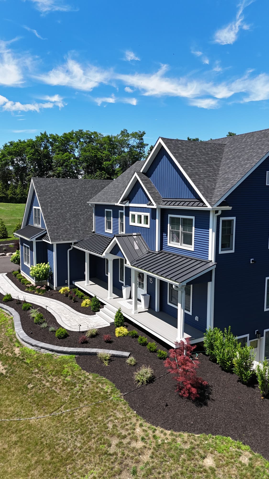 Navy blue siding and white trimmed windows on a home in New Windsor, NY